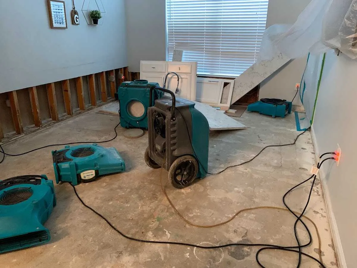 Dehumidifier in flood-cut room for Water Damage Restoration in Marcy